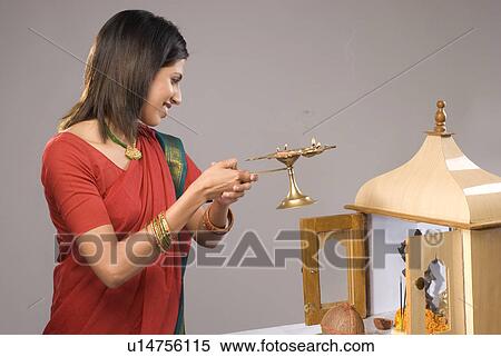 Stock Photography - A woman praying. Fotosearch