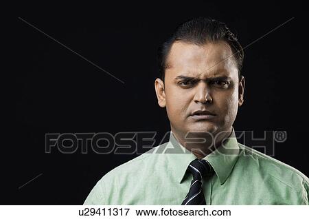 An irritated executive View Large Photo Image Stock Photo - An irritated executive. Fotosearch