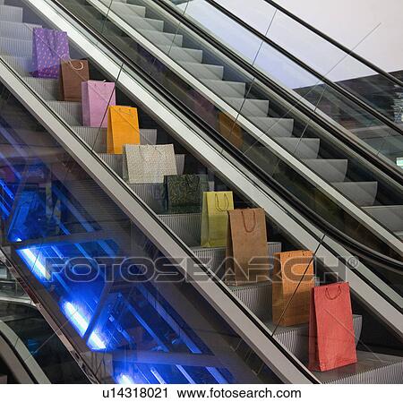 Stock Image - Bags on escalator. Fotosearch