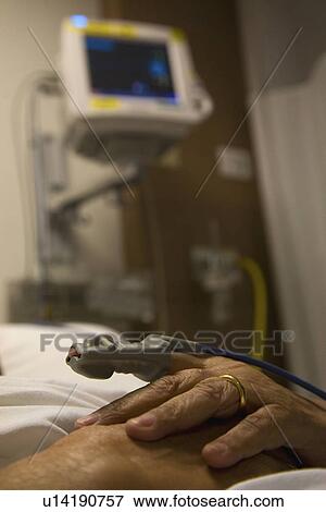 Stock Photo - Blood pressure finger monitor. Fotosearch