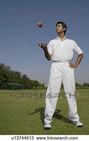 Stock Image - Bowler tossing a ball. Fotosearch