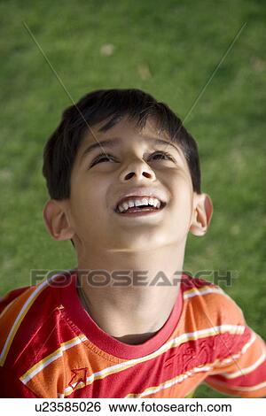 Boy looking up View Large Photo Image Stock Photograph - Boy looking up. Fotosearch