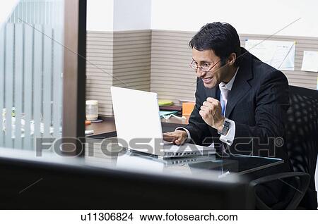Picture - Business executive excited. Fotosearch