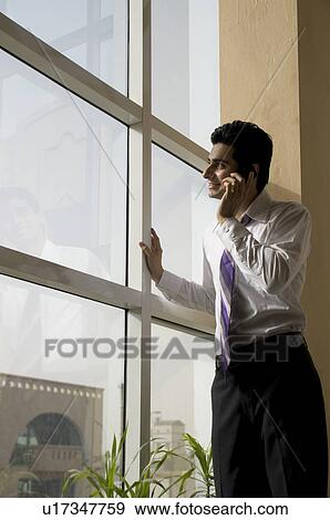 Business executive on the phone View Large Photo Image Stock Photo - Business executive on the phone. Fotosearch