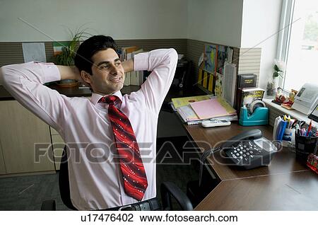Business executive relaxing View Large Photo Image Stock Image - Business executive relaxing. Fotosearch