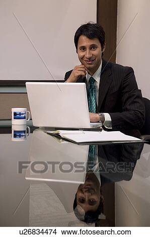 Business executive with laptop View Large Photo Image Picture - Business executive with laptop. Fotosearch