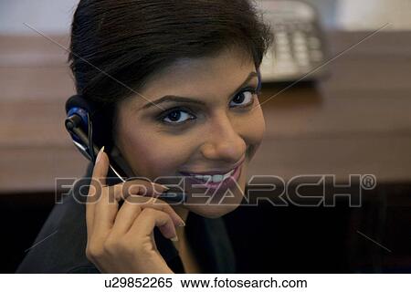 Stock Photography - Business executive with microphone. Fotosearch