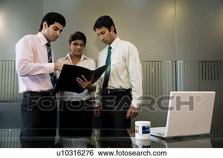 Stock Photograph - Business executives discussing. Fotosearch