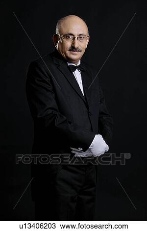 Butler standing View Large Photo Image Stock Image - Butler standing. Fotosearch