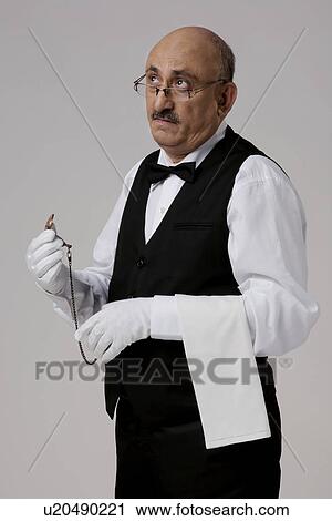 Stock Image - Butler thinking. Fotosearch