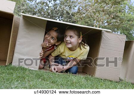Picture - Children inside a box. Fotosearch