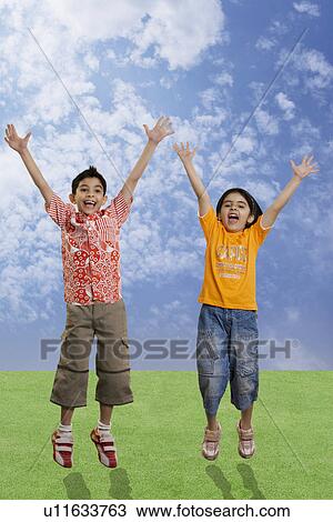 Stock Image - Children jumping with joy. Fotosearch