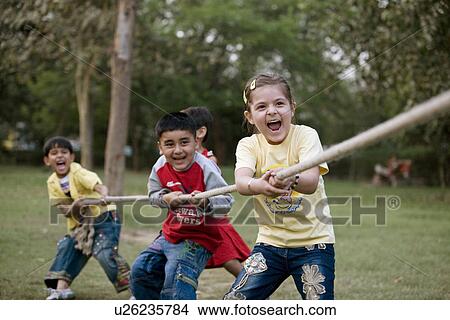 Children pulling a rope View Large Photo Image Picture - Children pulling a rope. Fotosearch