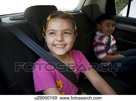 Children sitting inside a car View Large Photo Image Stock Photo - Children sitting inside a car. Fotosearch