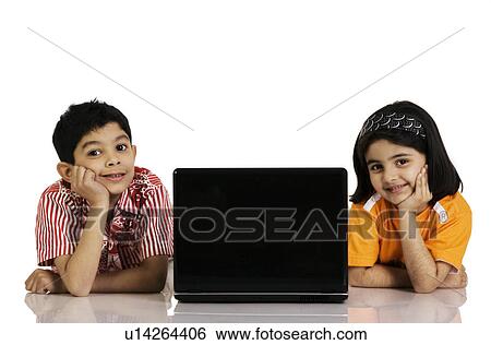 Children with a laptop View Large Photo Image Stock Photograph - Children with a laptop. Fotosearch