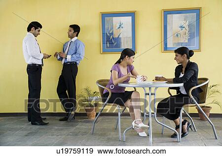 Colleagues taking a break View Large Photo Image Stock Photo - Colleagues taking a break. Fotosearch