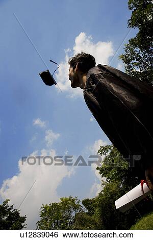 Stock Photograph - College student at graduation ceremony. Fotosearch