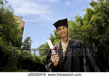 Stock Photograph - College student at graduation ceremony. Fotosearch