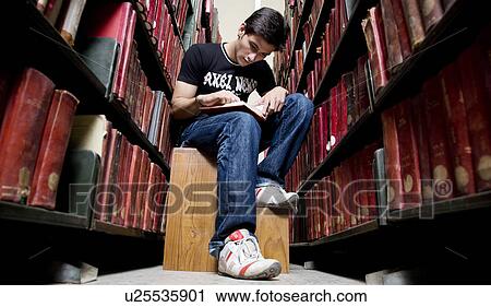College student in the library View Large Photo Image Stock Image - College student in the library. Fotosearch