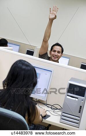 College student raising his hand View Large Photo Image Stock Photo - College student raising his hand. Fotosearch