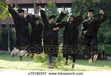 Stock Photo - College students at graduation ceremony. Fotosearch