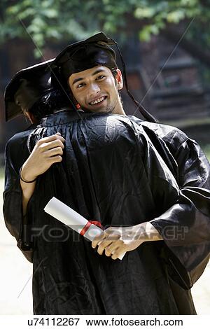 Stock Photo - College students at graduation ceremony. Fotosearch