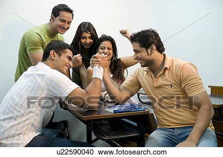 Stock Image - College students having fun. Fotosearch