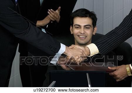 Stock Image - Congratulating each other. Fotosearch