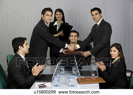 Congratulating each other View Large Photo Image Stock Photo - Congratulating each other. Fotosearch