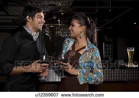 Stock Photo - Couple at the bar. Fotosearch