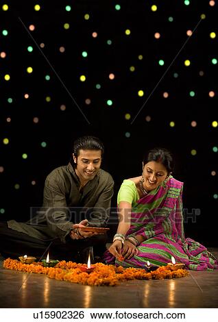 Couple celebrating Diwali View Large Photo Image Stock Photograph - Couple celebrating Diwali. Fotosearch