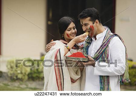 Couple celebrating Holi Festival View Large Photo Image Stock Image - Couple celebrating Holi Festival . Fotosearch