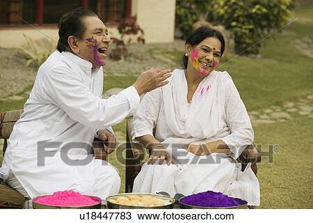 Stock Image - Couple celebrating Holi. Fotosearch