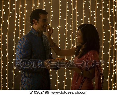 Couple eating sweets View Large Photo Image Stock Photo - Couple eating sweets. Fotosearch