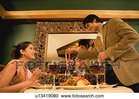 Couple enjoying a meal View Large Photo Image Stock Image - Couple enjoying a meal. Fotosearch