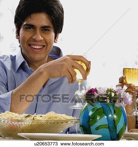 Stock Image - Couple enjoying a meal. Fotosearch