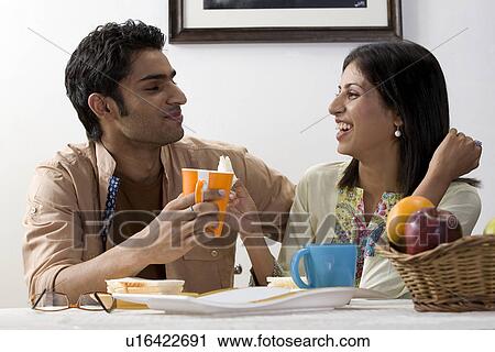 Stock Image - Couple having breakfast. Fotosearch