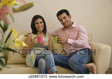 Couple having tea together View Large Photo Image Stock Image - Couple having tea together. Fotosearch