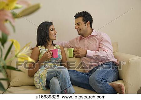 Couple having tea together View Large Photo Image Stock Photography - Couple having tea together. Fotosearch