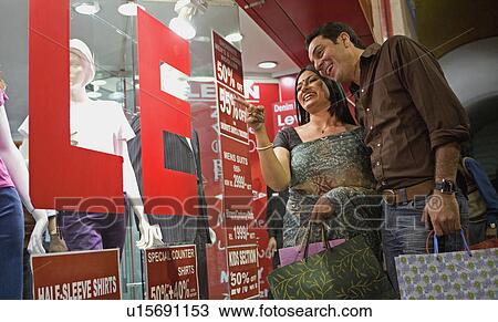 Couple shopping View Large Photo Image Stock Image - Couple shopping. Fotosearch