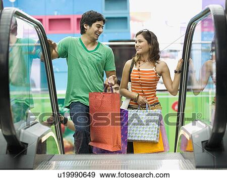 Couple shopping View Large Photo Image Stock Photo - Couple shopping. Fotosearch