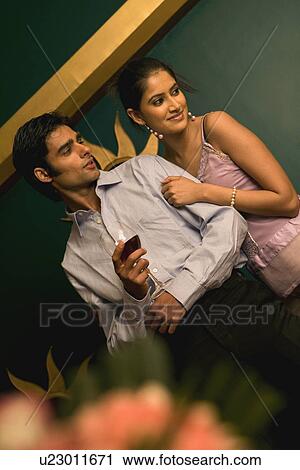 Couple standing together View Large Photo Image Stock Image - Couple standing together. Fotosearch