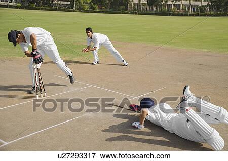 Stock Photo - Cricketers in action. Fotosearch