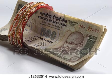 Picture - Currency and jewelery. Fotosearch