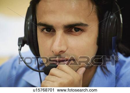 Stock Image - Customer Service Executive in Office. Fotosearch