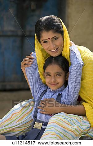 Stock Photo - Daughter holding her mother. Fotosearch