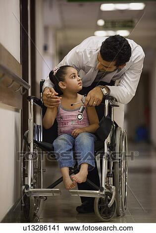 Doctor cheering his young patient View Large Photo Image Stock Image - Doctor cheering his young patient. Fotosearch