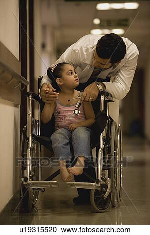 Doctor cheering his young patient View Large Photo Image Stock Image - Doctor cheering his young patient. Fotosearch