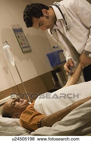 Stock Photo - Doctor giving an injection. Fotosearch