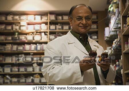 Stock Photo - Doctor in drug storeroom. Fotosearch